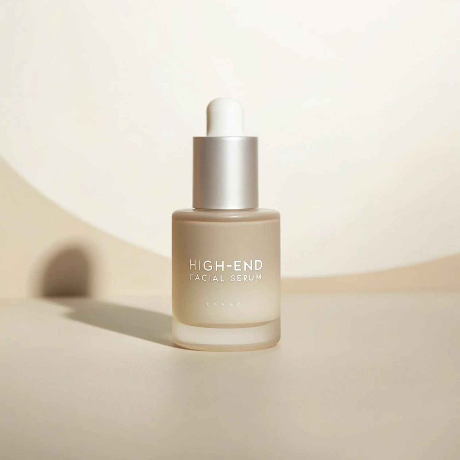 Frosted glass serum bottle on a soft beige background
